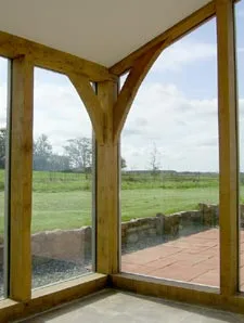 Glazing fitted to the outside of a frame with external cover boards
